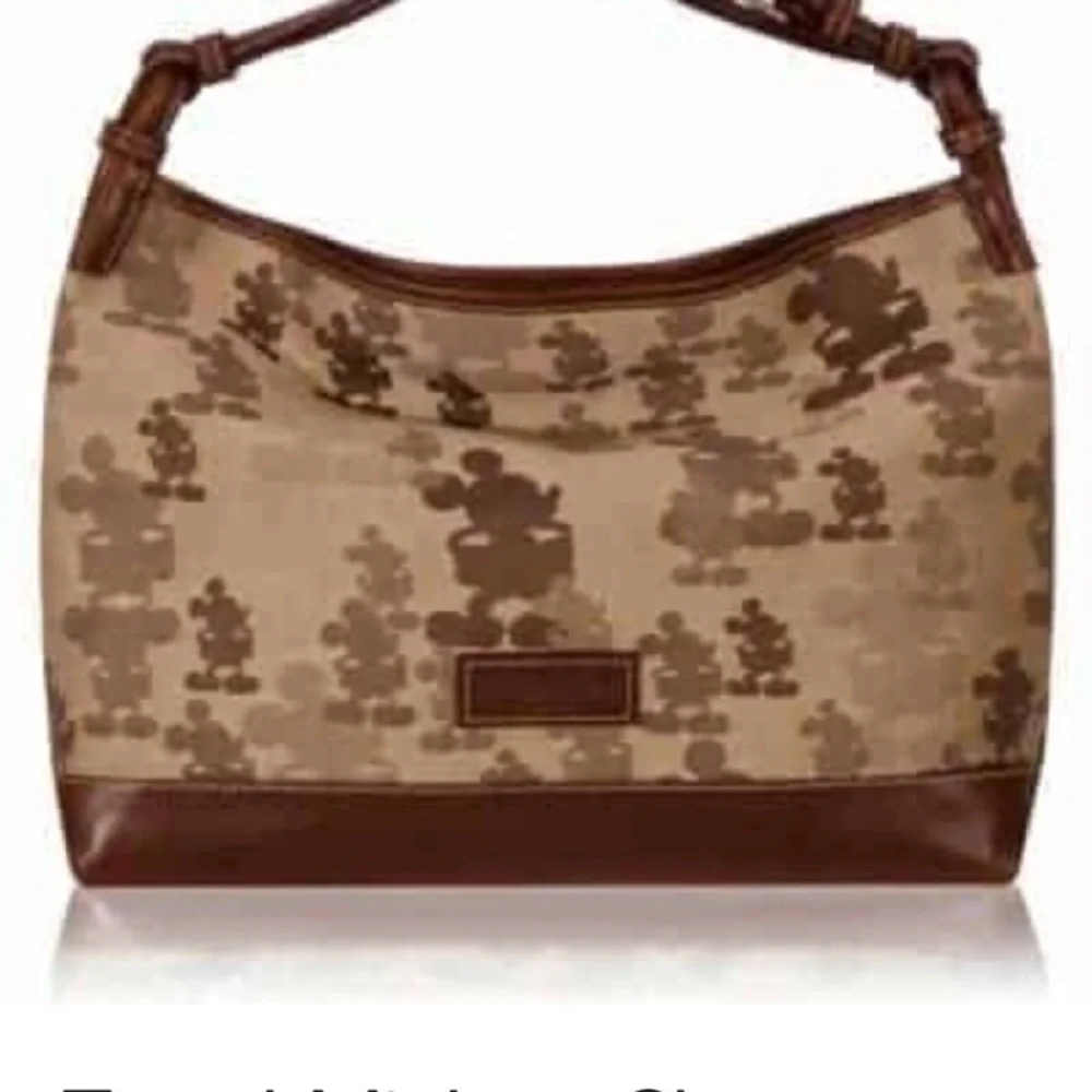 Dooney and Bourke Tan and Brown purse .
